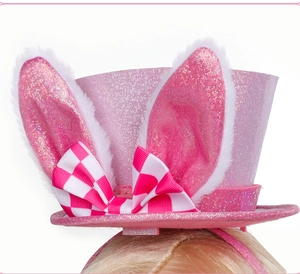 Detail of pink glitter mini hat headband with rabbit ears and checkered bow hair accessory