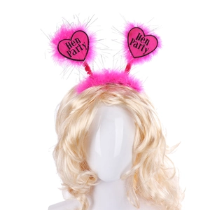 Close-up of bright pink Hen Party headband with fluffy feathers and heart decorations