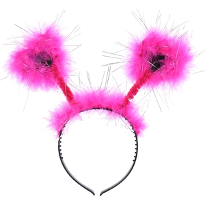 Detail of hot pink feather headband with shimmering tinsel and heart springs for hen parties