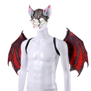 Detail of bat mask and wings set with red fabric texture and elastic straps for Halloween