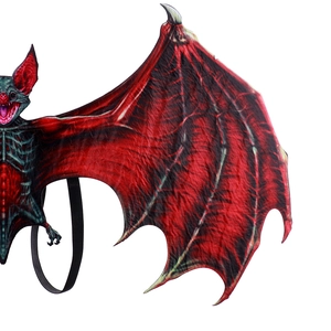 Detail of red and black bat wings costume accessory with realistic bone texture and straps