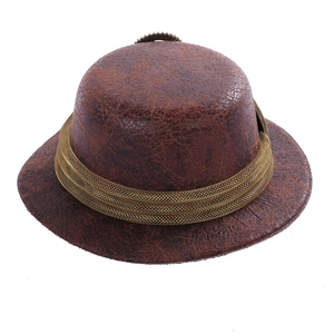 Detail of steampunk mini top hat with gear ornament and metallic mesh band on brown leather