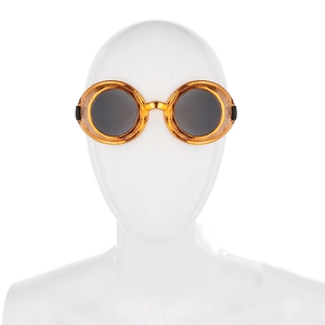 Close-up of steampunk goggles with gold frames, gear detailing and adjustable strap