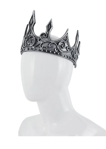 Close-up of vintage silver medieval crown with intricate gothic scrolls and ornate spikes