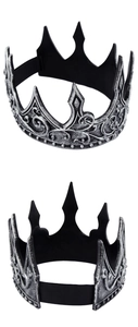 Detail of medieval king crowns with ornate silver floral patterns and elastic straps