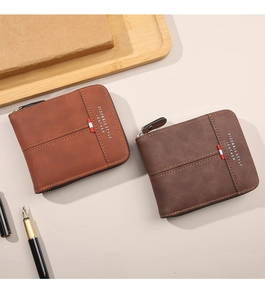 Detailed close-up of brown leather men's wallet with metal zipper and stylish tricolor trim