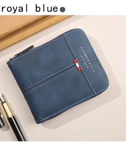 Detail of royal blue leather wallet with white stitching and stylish red ribbon trim