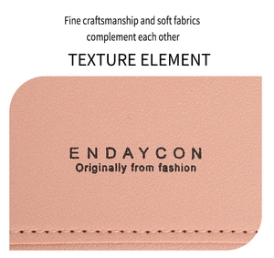 Macro shot of pink lychee grain leather texture and precise stitching on phone bag