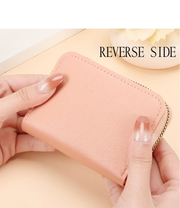 Pink lychee texture card holder wallet showing compact size and gold zipper detail