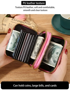 Detail of pink RFID leather wallet with double zippers showing interior card slots