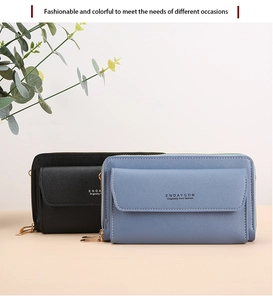 Detail view of leather long wallets in black and blue with gold zipper hardware