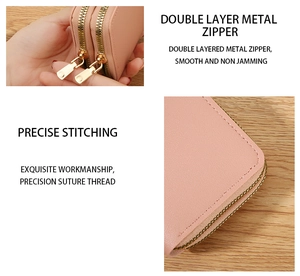 Close-up of pink PU leather card holder showing dual gold zippers and precision stitching