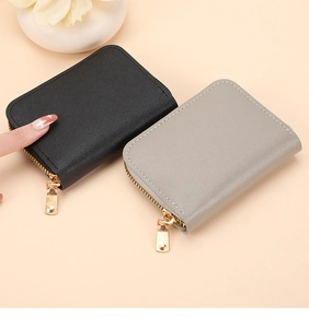 Close-up of litchi-textured PU leather card holder with premium gold zippers