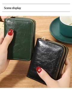 Detailed macro view of RFID leather organ card wallets in black and dark green
