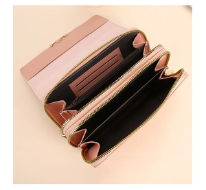 Detailed interior of pink leather long wallet featuring multiple card slots and zip pocket