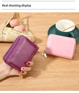 Close-up of vintage purple RFID leather card wallet with secure double zipper closure