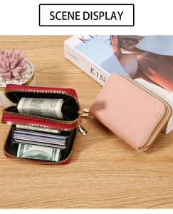 Close-up of double zipper card holders in red and pink with multiple card slots