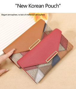 Detail of color-block leather wallets with lychee texture and gold metal buckles