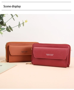 Detail view of lychee grain leather crossbody phone bags in brown and deep red colors