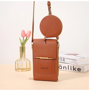 Brown leather touchscreen phone bag with a round coin purse and gold metal detail