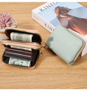 Dual zipper organizer wallet showing accordion card slots and compact inner storage