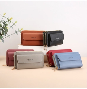 Detail of multi-color crossbody phone wallets featuring pebble grain PU leather and double zippers