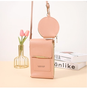 Detail of pink PU leather touchscreen phone bag with matching round coin purse and strap