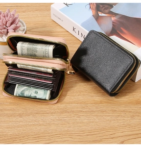 Close-up of double zipper leather card wallet showing large capacity for cards and cash
