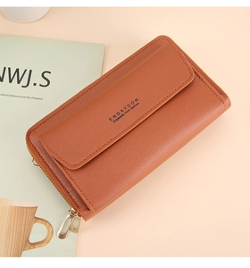 Detail of caramel faux leather crossbody phone wallet with secure magnetic flap and zipper