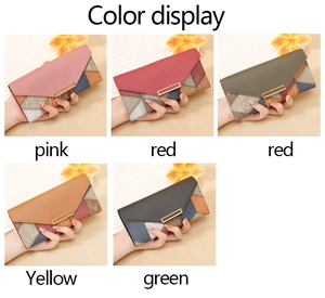 Detailed color display of long envelope wallets with geometric patchwork and metal accents
