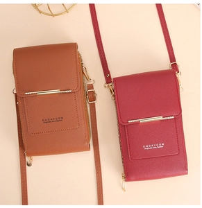 Close-up of vertical faux leather mobile pouches in dark brown and wine red