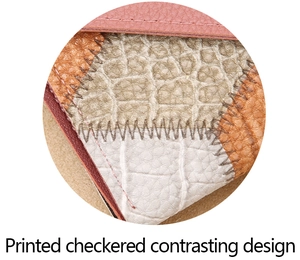 Close-up of checkered patchwork wallet with contrasting crocodile and pebbled leather textures