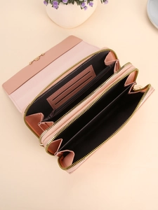 Women's long faux leather wallet with double zippers and multiple card slots in pink