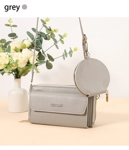 Grey multi-functional crossbody bag with accordion folds and circular coin purse detail
