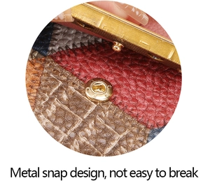 Detail of durable star-patterned metal snap button on a textured patchwork leather wallet