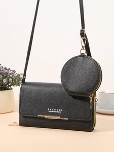 Elegant black faux leather crossbody bag with small round coin purse and gold hardware