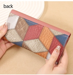 Detailed back view of long wallet featuring geometric color-block patchwork with lychee texture