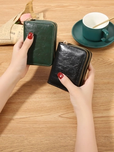 Handheld RFID blocking double-zipper wallet in dark green and black textured leather