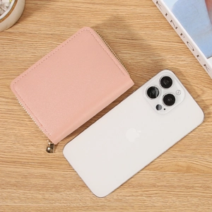 Pink leather accordion credit card wallet with dual gold zippers and compact design