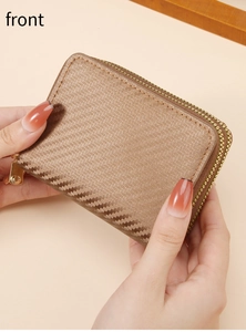 Brown woven card holder with gold zipper detail, handheld view of the front exterior