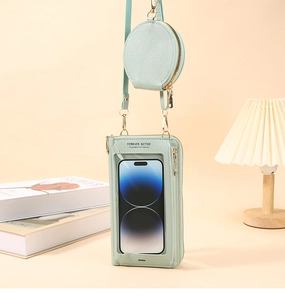 Dettaglio borsa porta cellulare verde menta con finestra touch e cerniere dorate