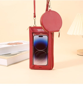 Dettaglio borsa per telefono in pelle rossa con finestra touch e portamonete rotondo rimovibile