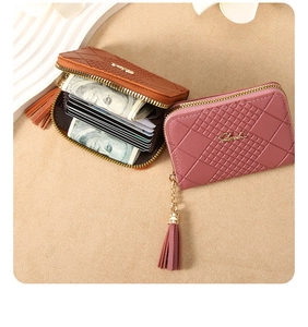 Detail of plaid embossed small zip wallets with multi-card slots and tassel charm