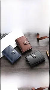 Detail view of carbon fiber texture card holders with automatic pop-up button and metal shell