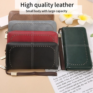 Detailed view of long RFID leather wallets featuring hollow laser-cut patterns and wrist straps
