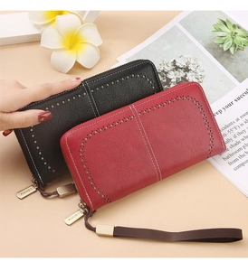 Detail view of RFID blocking wallets with hollow dots and retro lychee leather texture