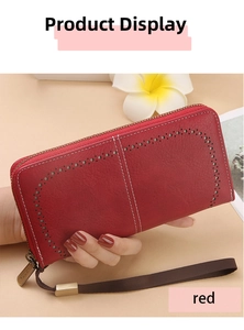 Detail of red RFID long wallet showing litchi grain leather and hollowed-out pattern