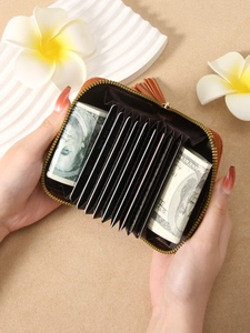 Brown leather accordion wallet with tassel zipper and multiple card slots