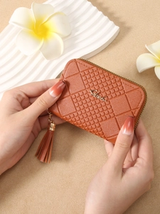 Brown leather women short wallet with geometric embossed pattern and tassel zipper