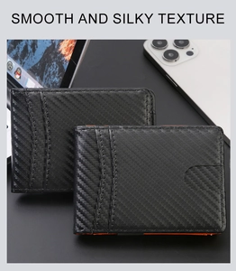 Slim carbon fiber wallet detail with RFID blocking and vibrant orange interior lining